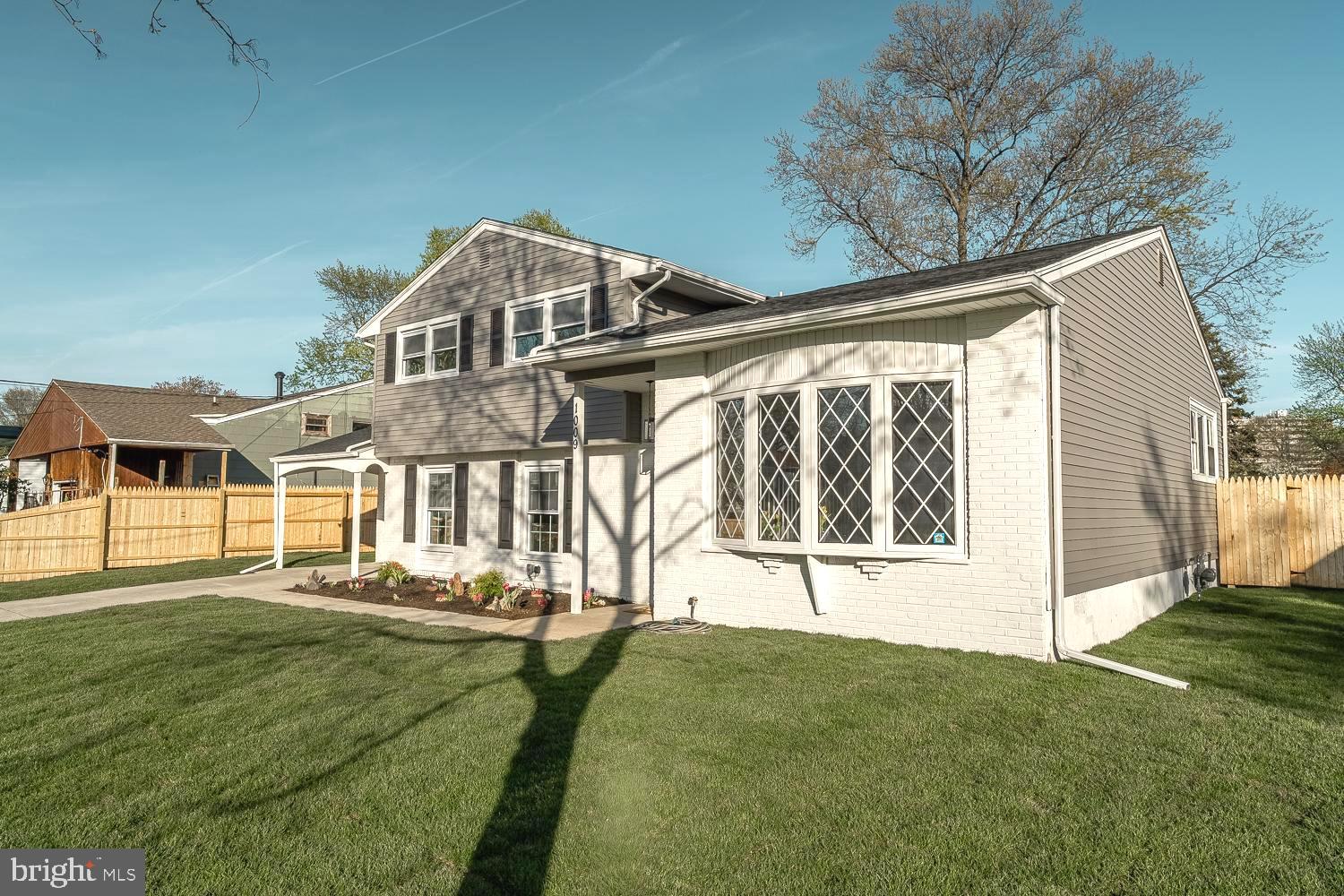 1009 Edgemoor Road Cherry Hill, NJ 08034 - Photo 39 of 49 a front view of a house with a yard