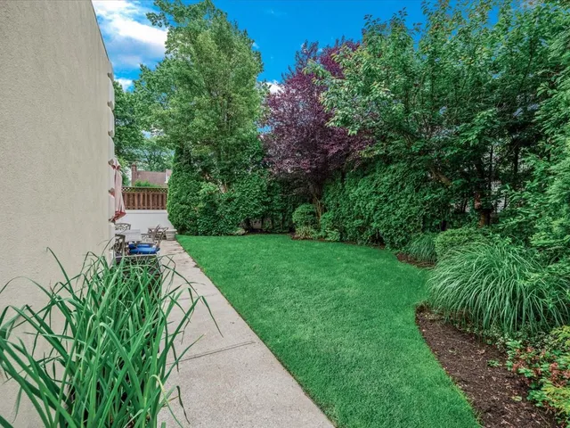 a front view of house with yard and outdoor seating