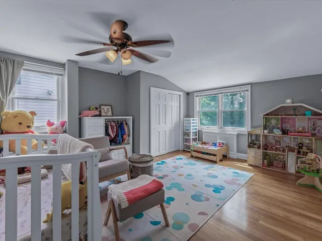 a view of a livingroom with furniture and a ceiling fan