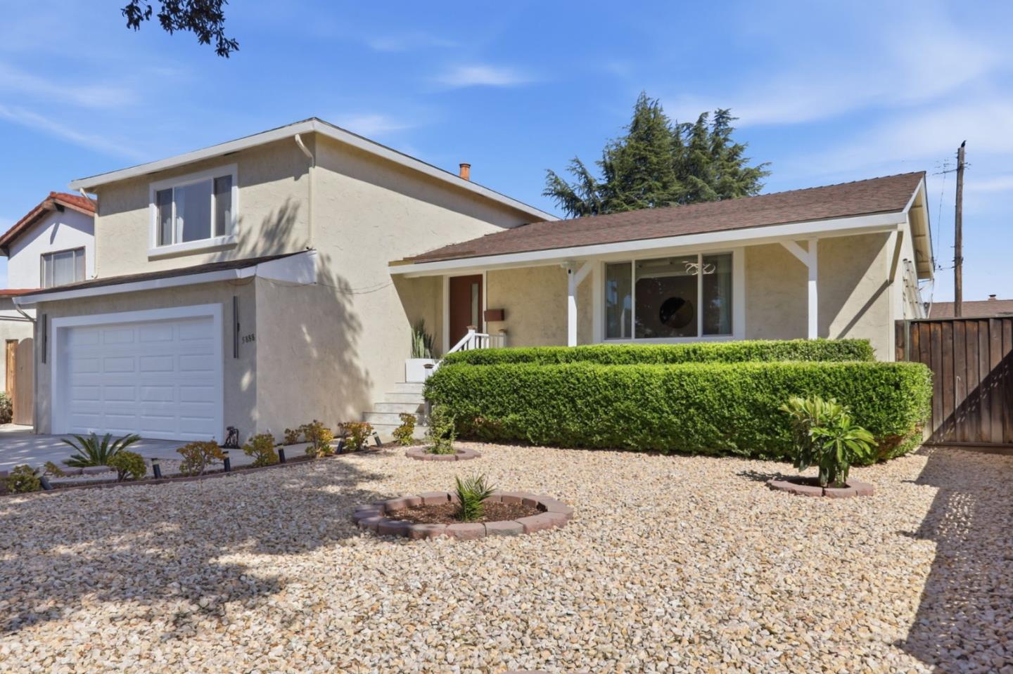 5888 Lean Way San Jose, CA 95123 - Photo 4 of 54 a front view of a house with a yard