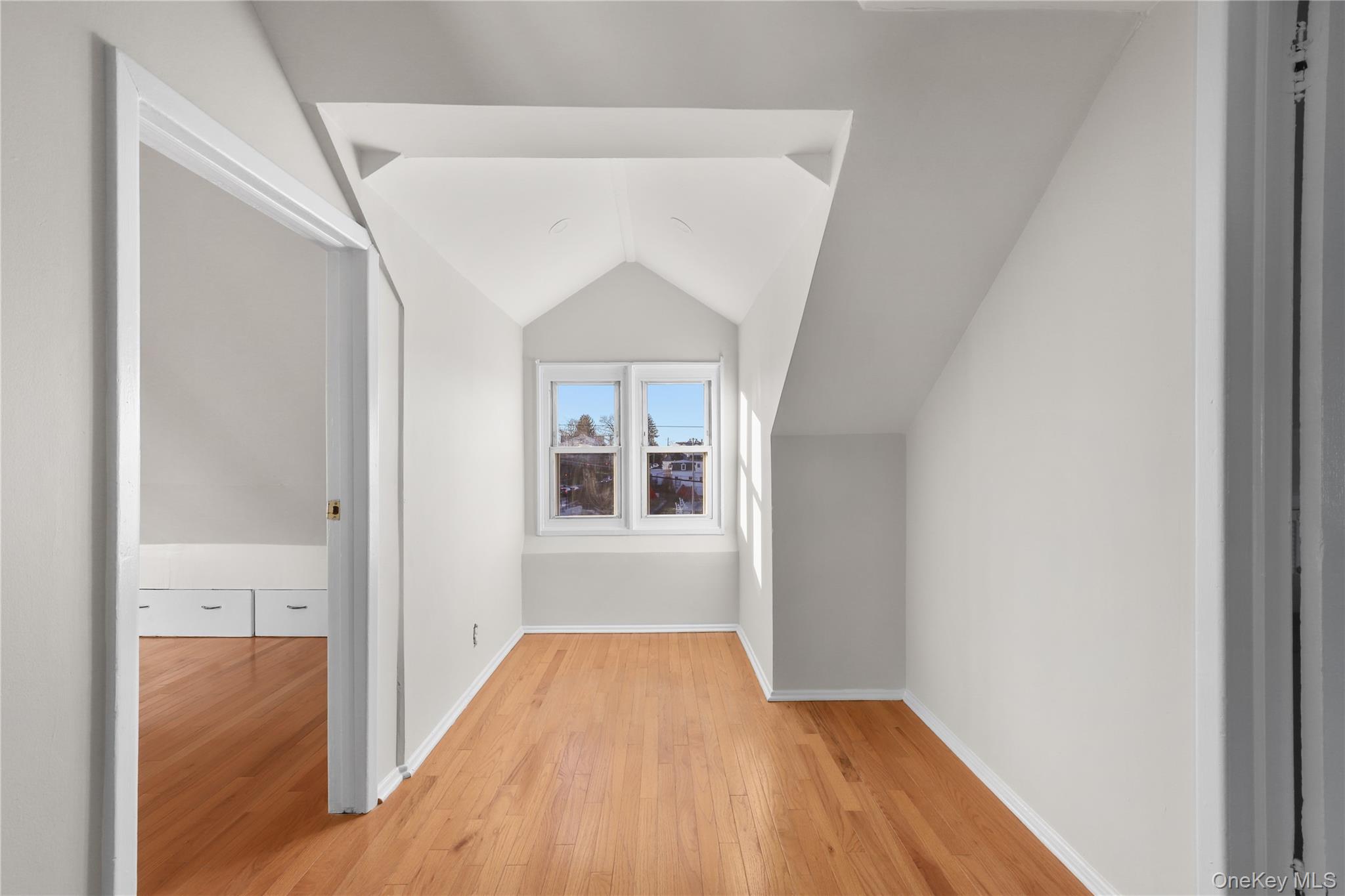 8 Virginia Avenue, Unit 1 Dobbs Ferry, NY 10522 - Photo 12 of 15 Bonus room with hardwood / wood-style floors and lofted ceiling