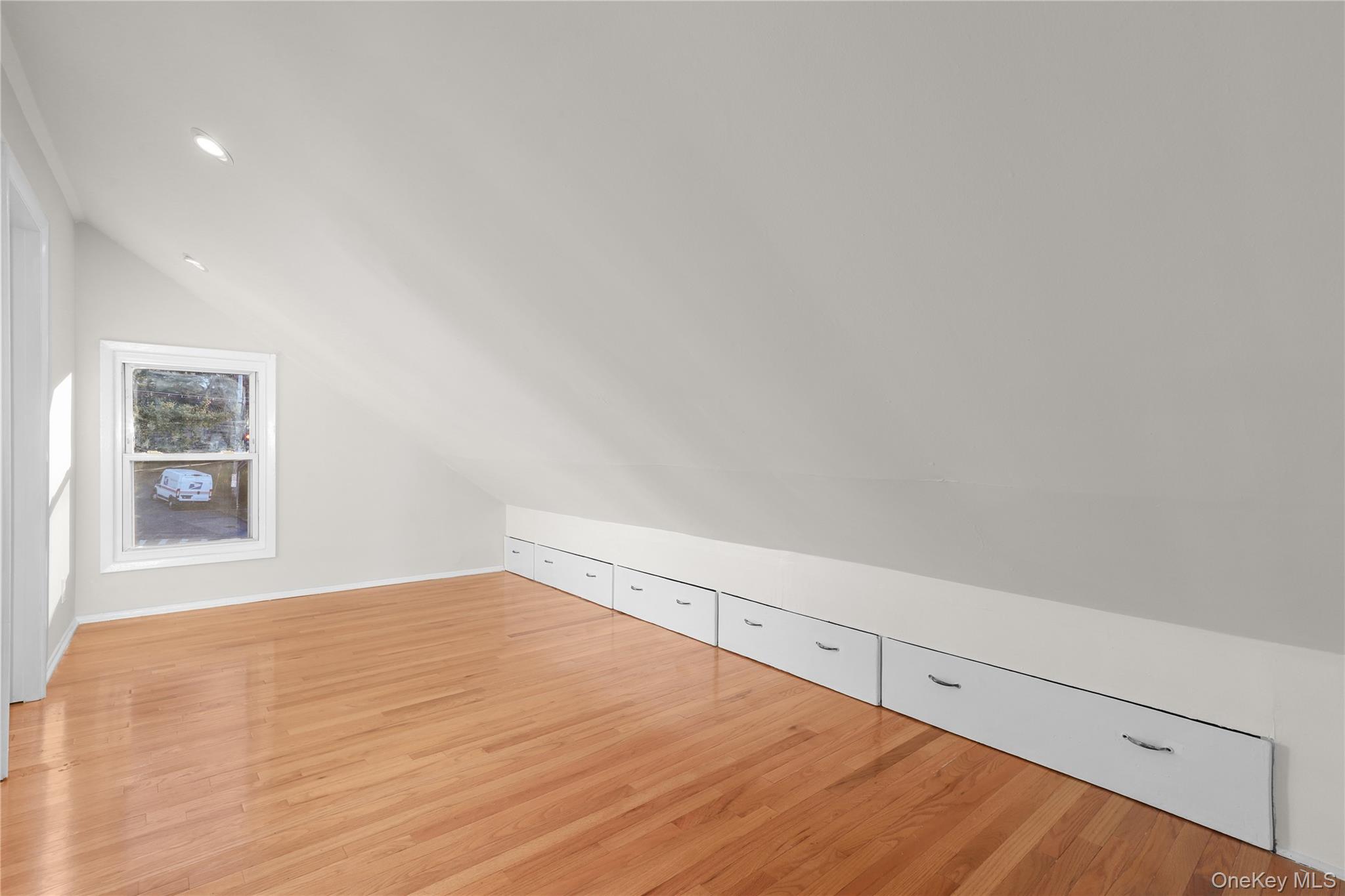 8 Virginia Avenue, Unit 1 Dobbs Ferry, NY 10522 - Photo 13 of 15 Additional living space with light wood finished floors and vaulted ceiling
