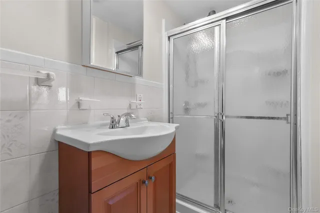 a bathroom with a sink and mirror