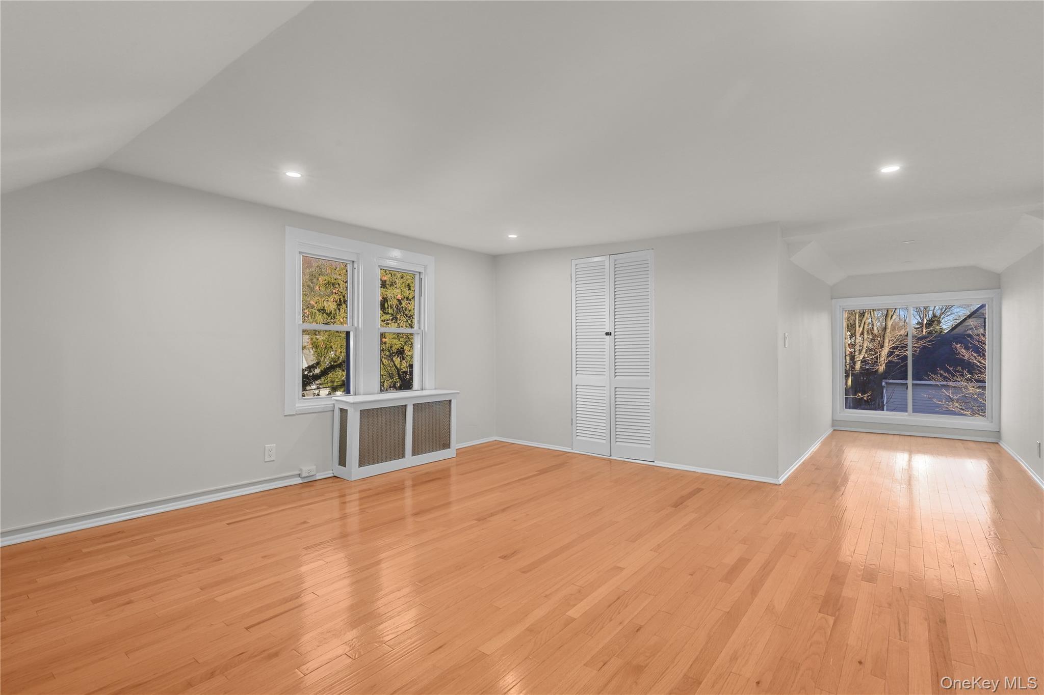 8 Virginia Avenue, Unit 1 Dobbs Ferry, NY 10522 - Photo 8 of 16 a view of an empty room with window and wooden floor