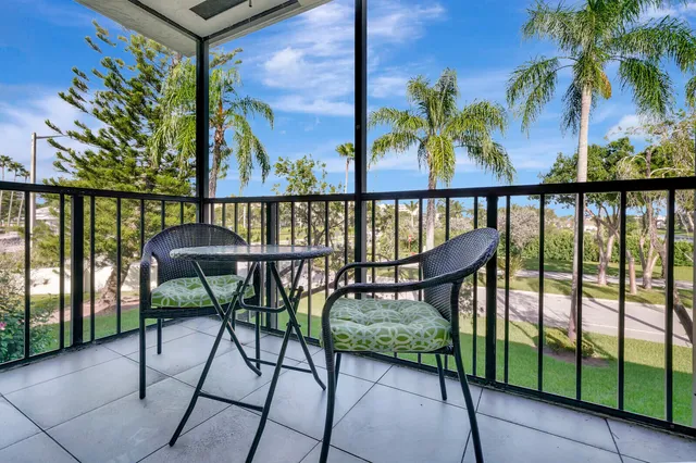 a view of a chairs and table in patio