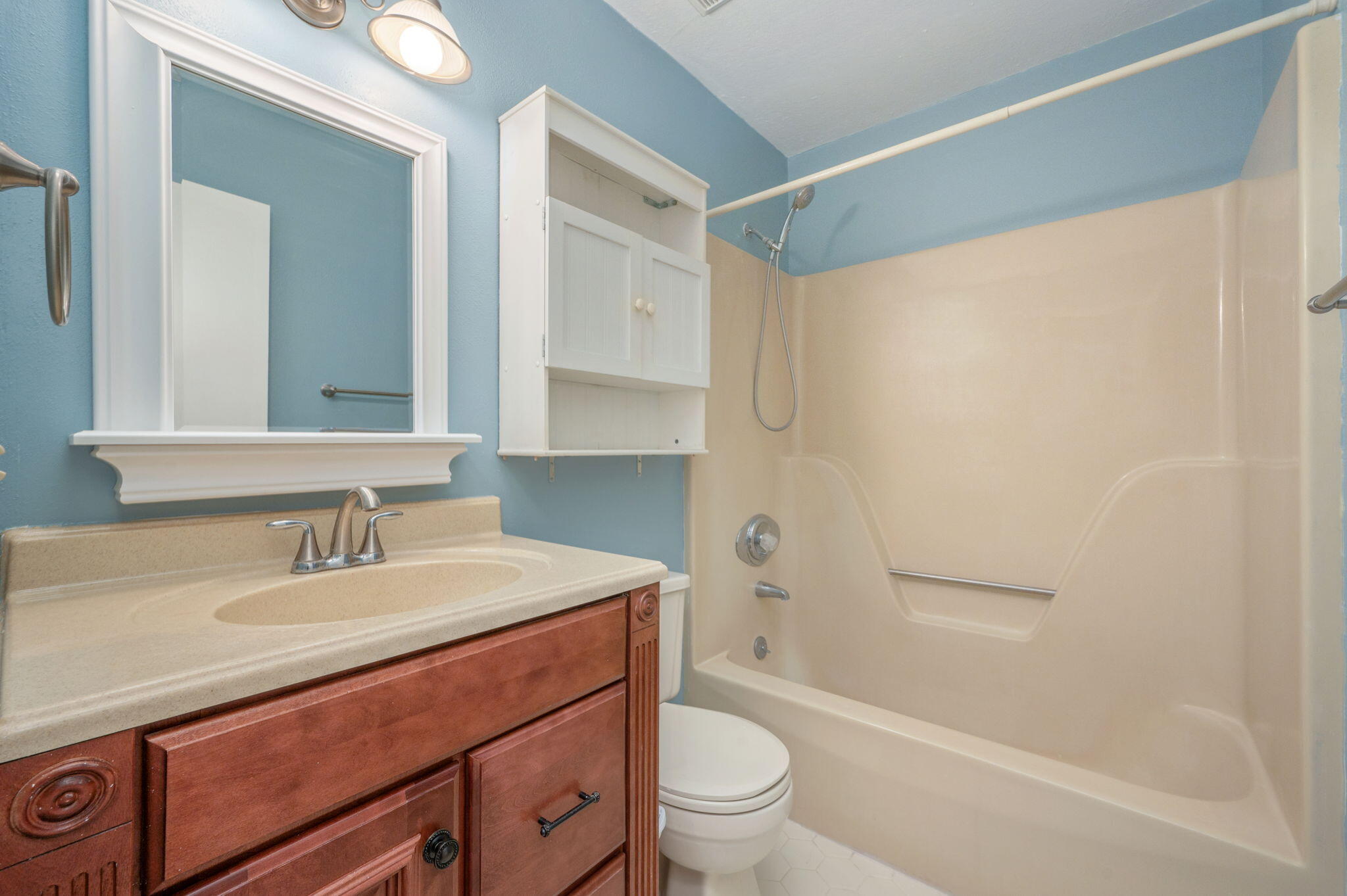 106 Campbell Street Crestview, FL 32536 - Photo 16 of 30 a bathroom with a sink a toilet and shower