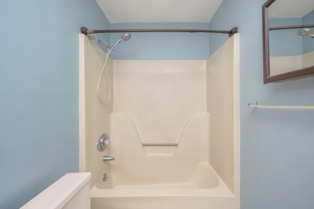 a bathroom with a white bath tub