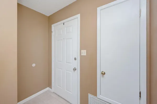 a view of a bathroom with a sink and a mirror