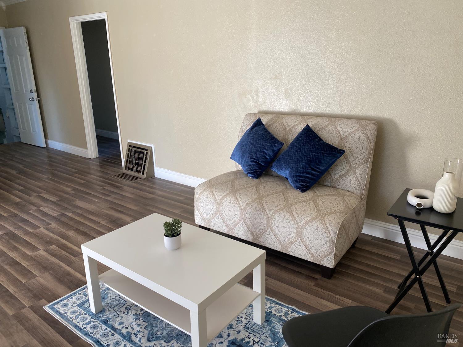 129 Foster Street Vallejo, CA 94591 - Photo 21 of 37 a living room with furniture and wooden floor
