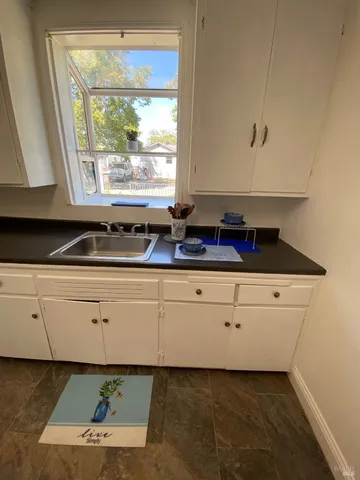 a view of living room with furniture and window