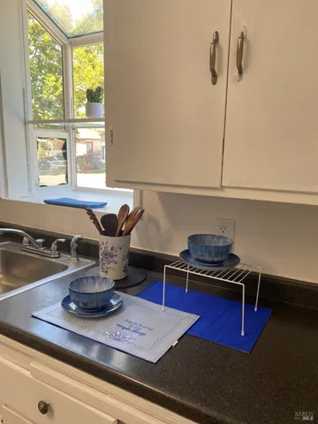 a bathroom with a sink mirror and vanity