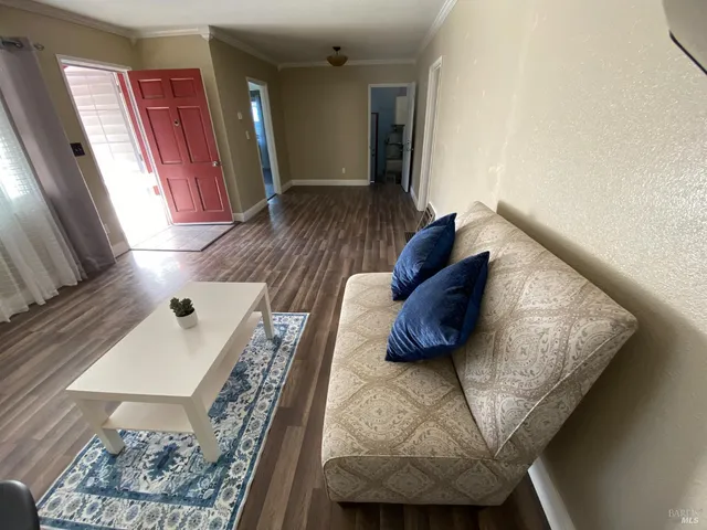 a view of a room with wooden floor and chair