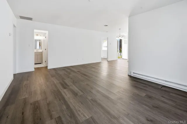 a view of a livingroom with wooden floor
