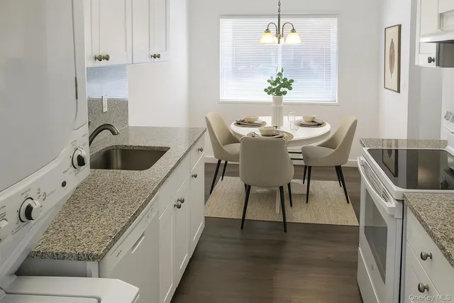 a living room with furniture and a sink