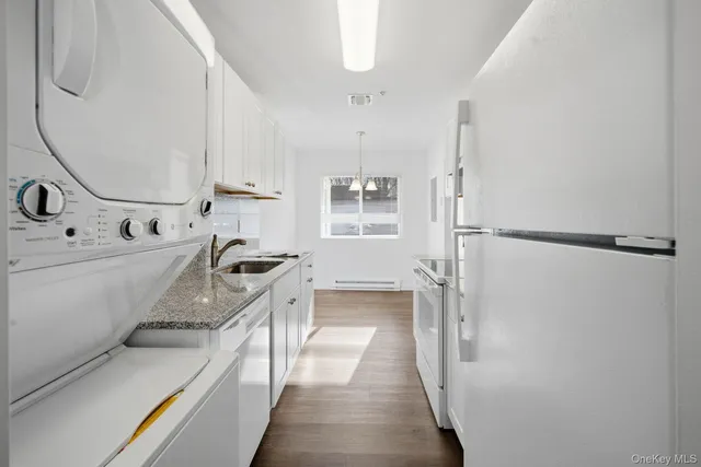 a kitchen with a sink stove and refrigerator