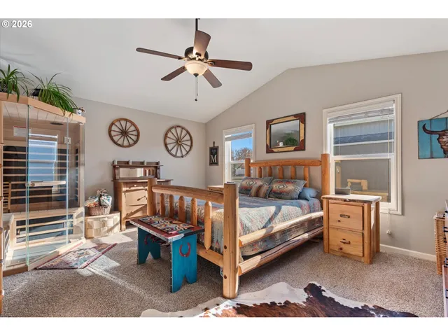 a bed room with a bed and a chandelier