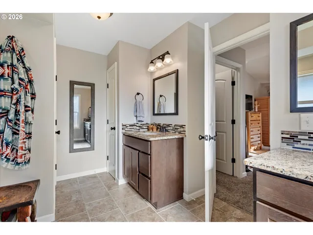 a kitchen with stainless steel appliances granite countertop a refrigerator and a stove