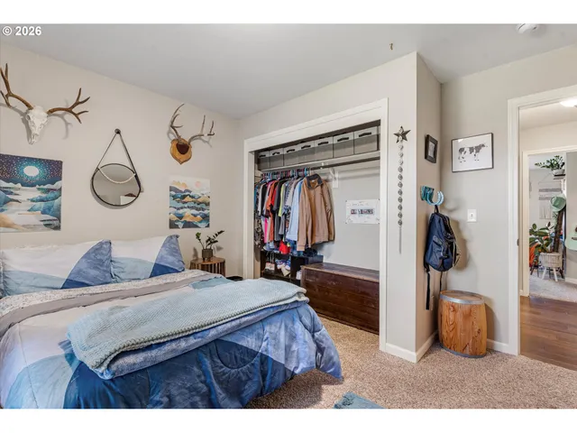 a bedroom with bed and a walk in closet