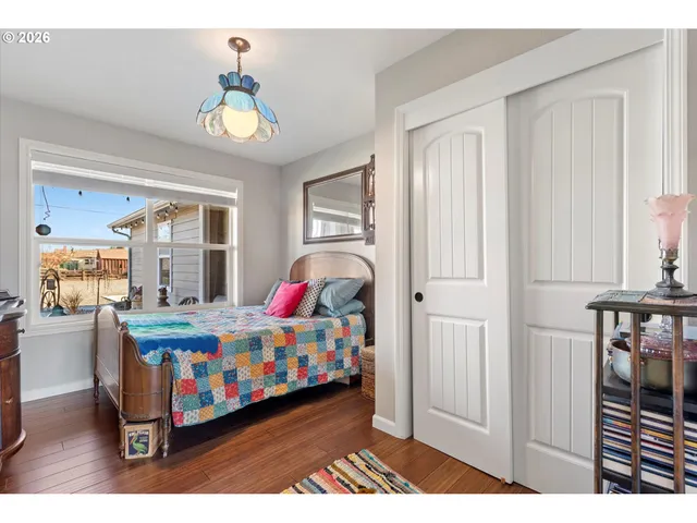 a living room with furniture and a dining area