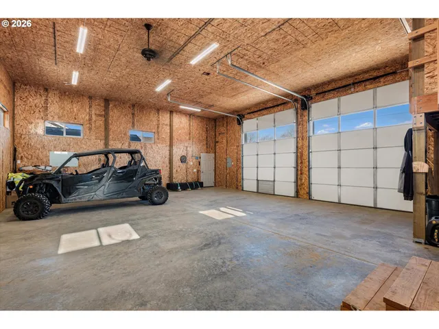 a view of a balcony with chairs and a stove
