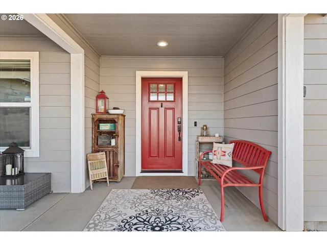a living room with furniture and a chair