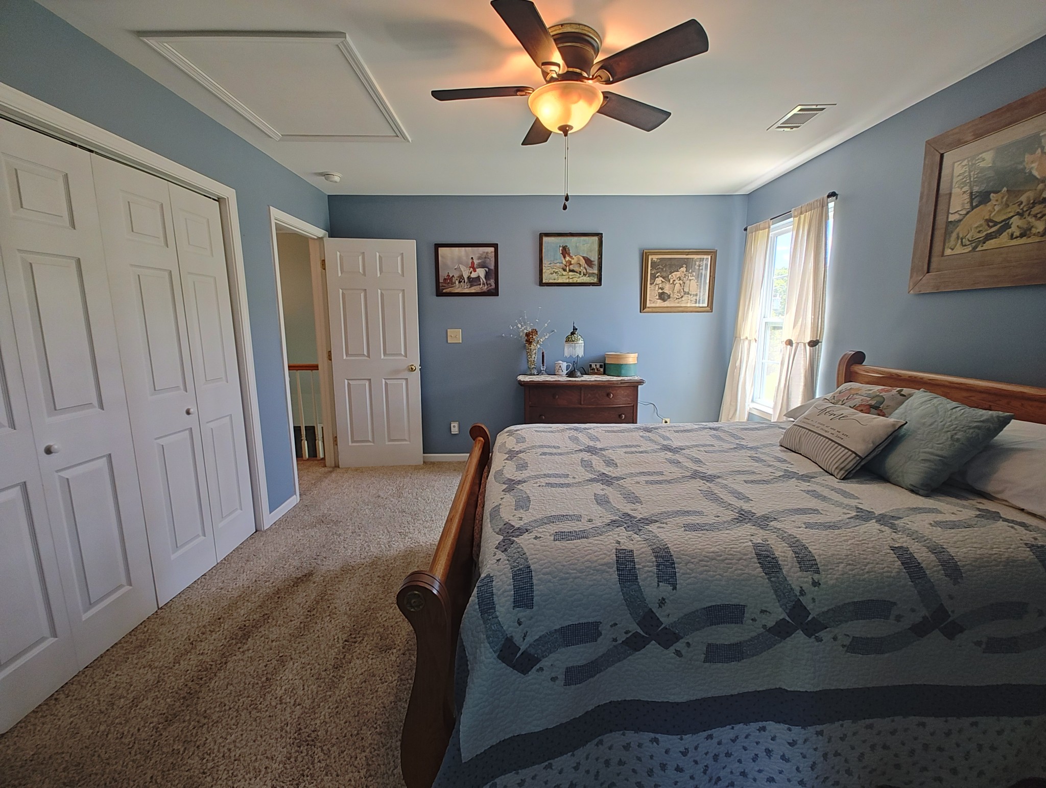 2770 Beech Log Road Watertown, TN 37184 - Photo 49 of 87 a bedroom with a bed and a chandelier