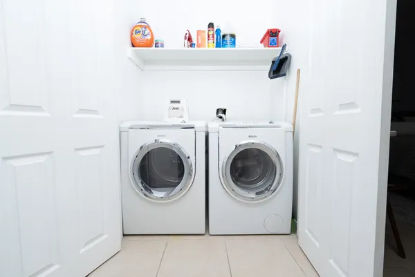 a utility room with dryer and washer