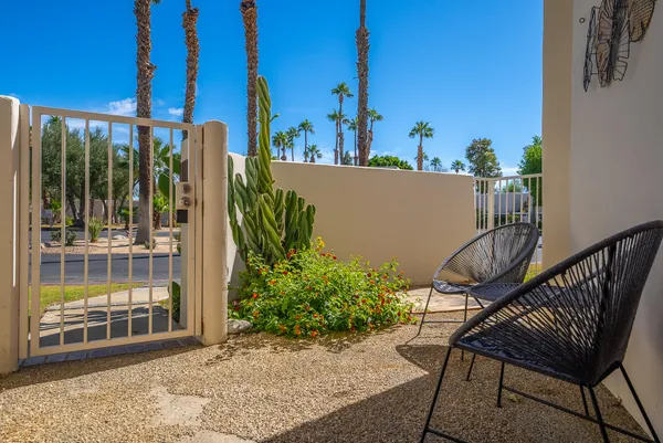 a view of a balcony with chairs