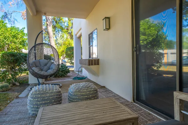a view of a house with garden and sitting area