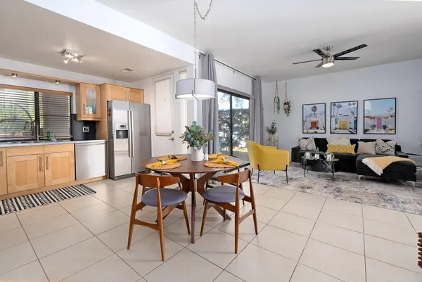 a outdoor space with lots of chairs and chandelier