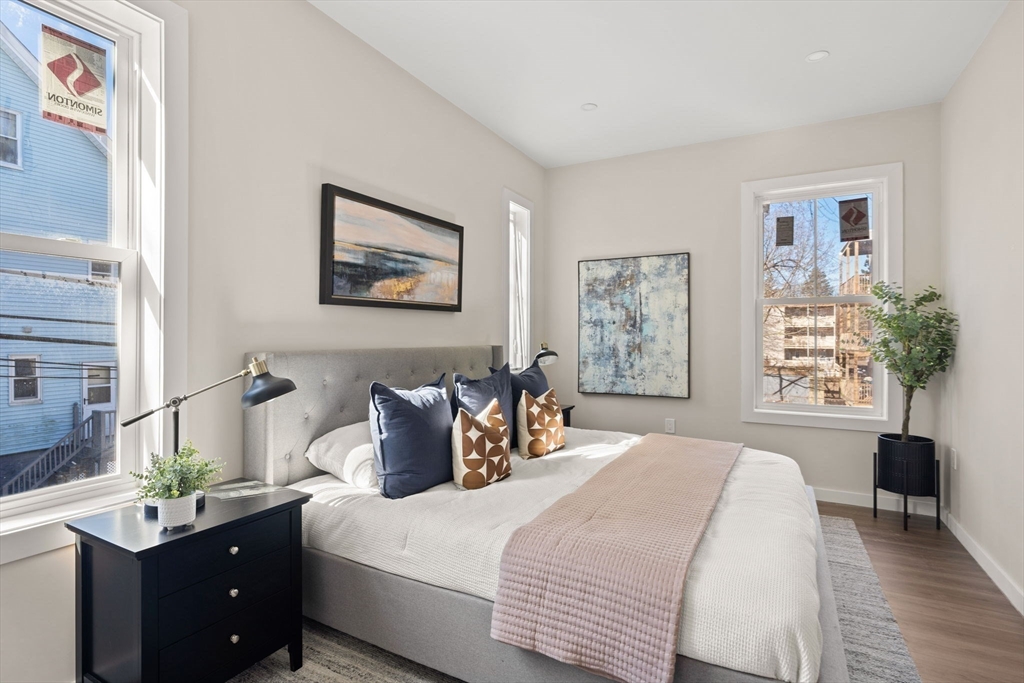 28 Hansborough Street, Unit FIVE Boston, MA 02124 - Photo 20 of 24 a bedroom with bed and window