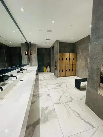 a bathroom with a large tub and sink