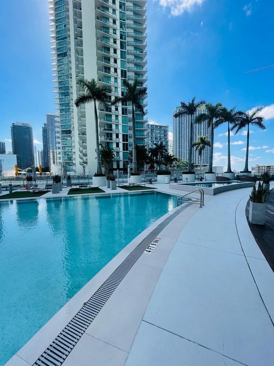 90 Southwest 3rd Street, Unit 2605 Miami, FL 33130 - Photo 8 of 15 a view of swimming pool from a balcony