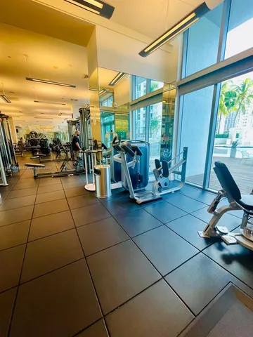 a view of a patio with a dining table and chairs