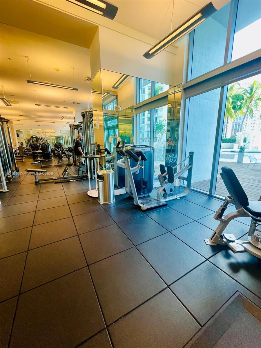 90 Southwest 3rd Street, Unit 2605 Miami, FL 33130 - Photo 9 of 15 a view of a patio with a dining table and chairs