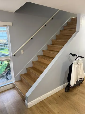 a view of entryway and wooden floor