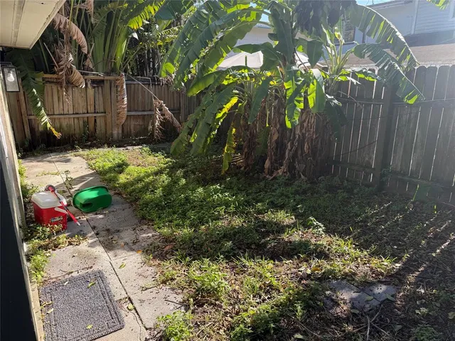 a backyard of a house with lots of green space