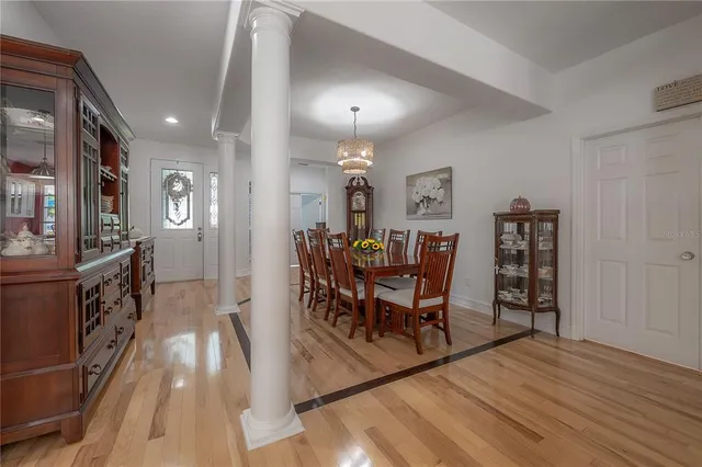 a view of a dining room with furniture and wooden floor