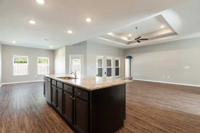 a kitchen with counter space and wooden floor