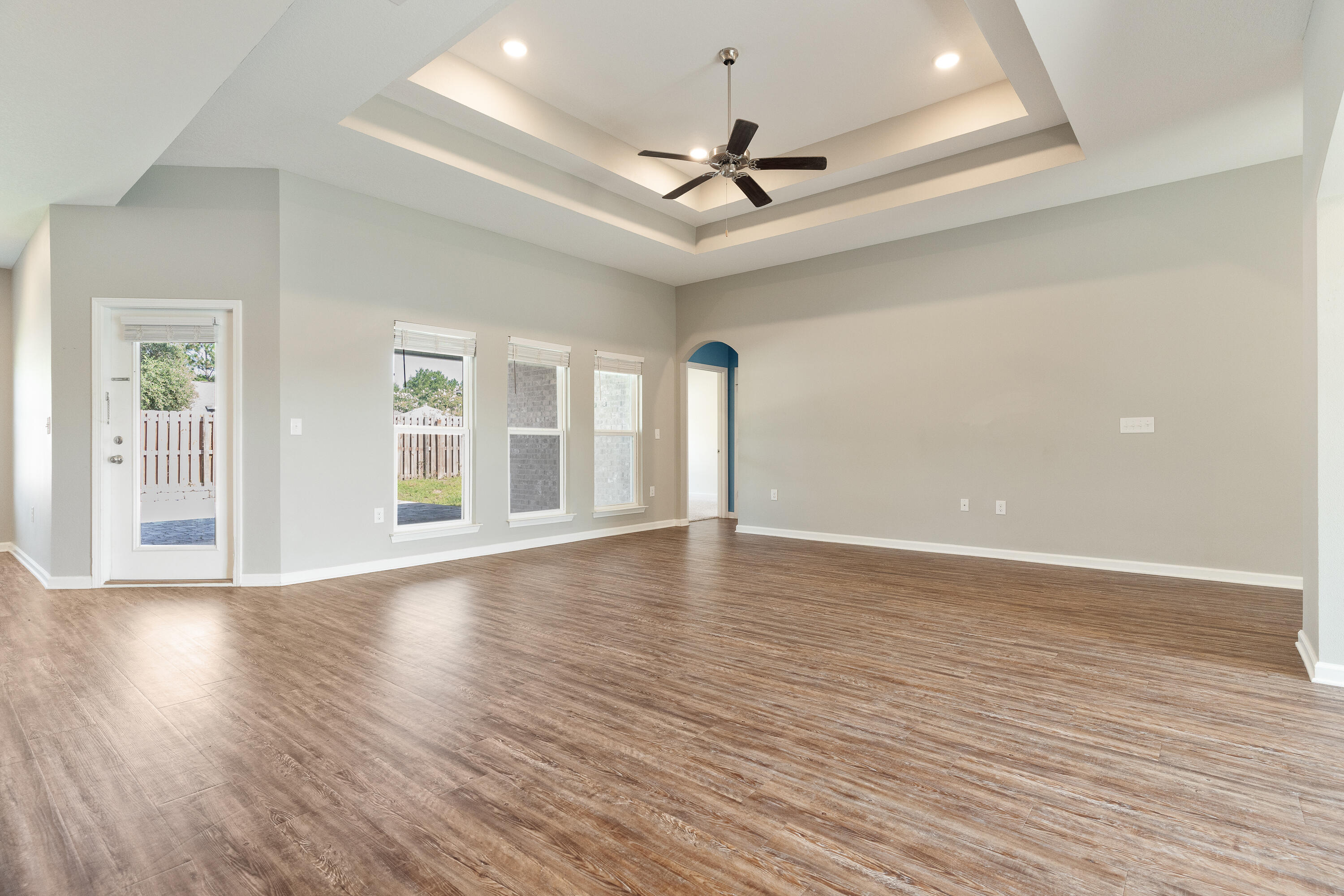 303 Merlin Court Crestview, FL 32539 - Photo 16 of 54 a view of an empty room with wooden floor and a window