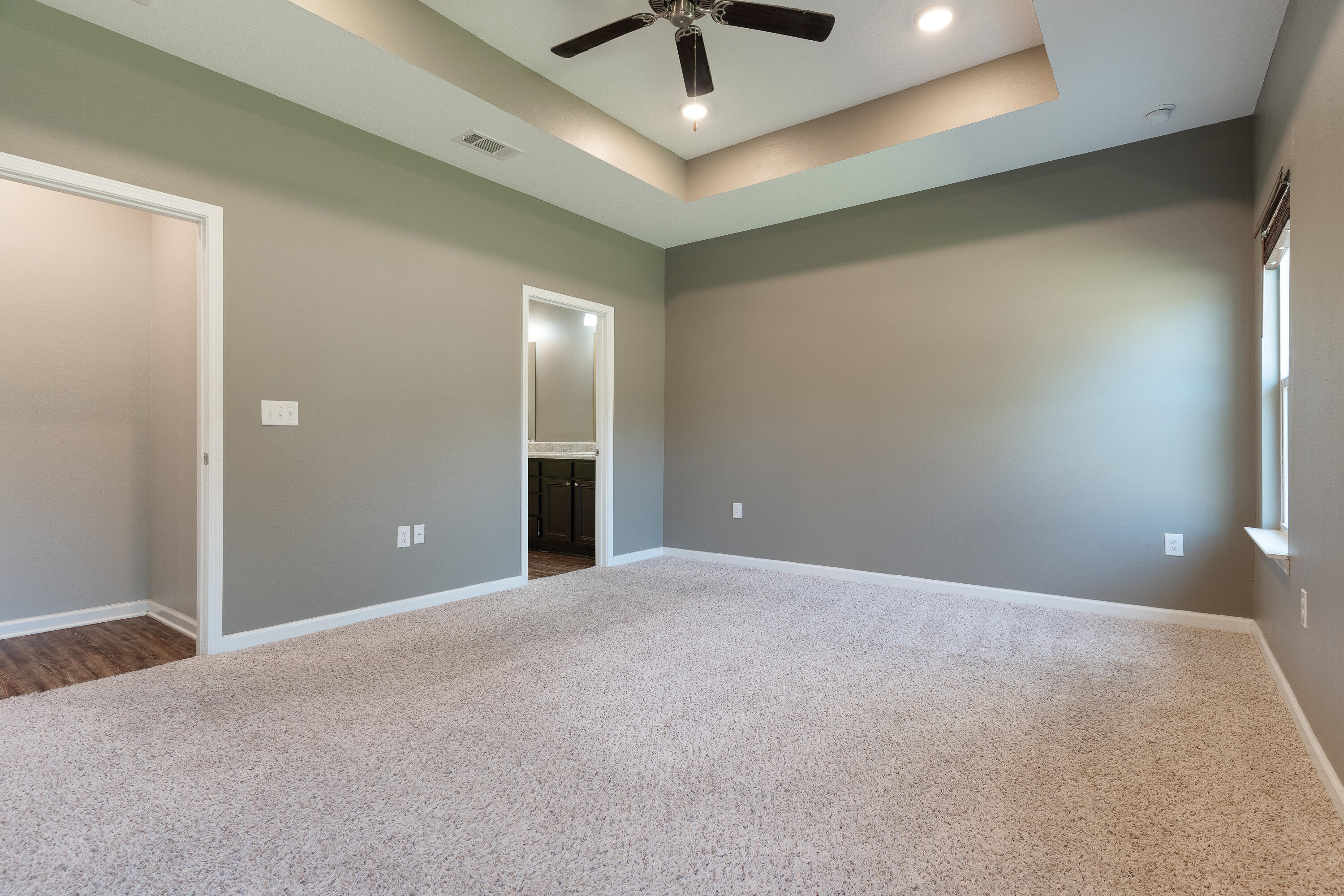 303 Merlin Court Crestview, FL 32539 - Photo 20 of 54 a view of an empty room and a ceiling fan and window