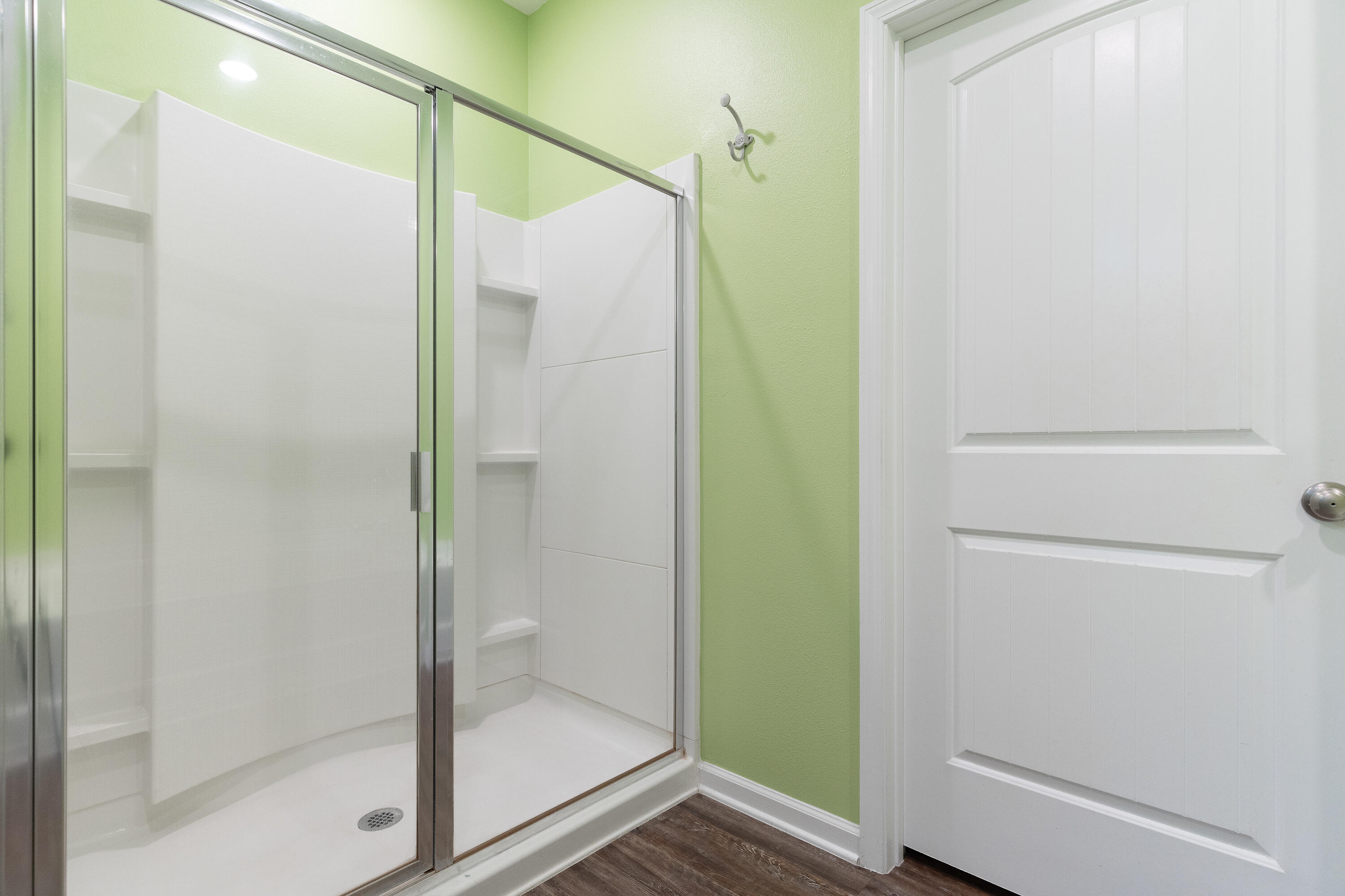 303 Merlin Court Crestview, FL 32539 - Photo 29 of 54 a bathroom with a glass shower door