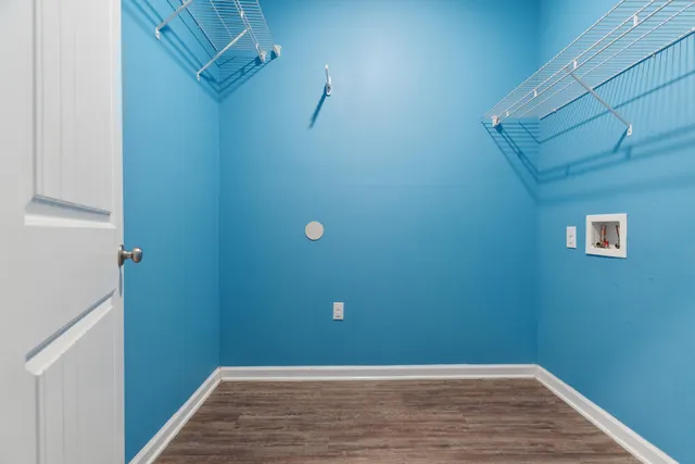 a view of a small space with wooden floor