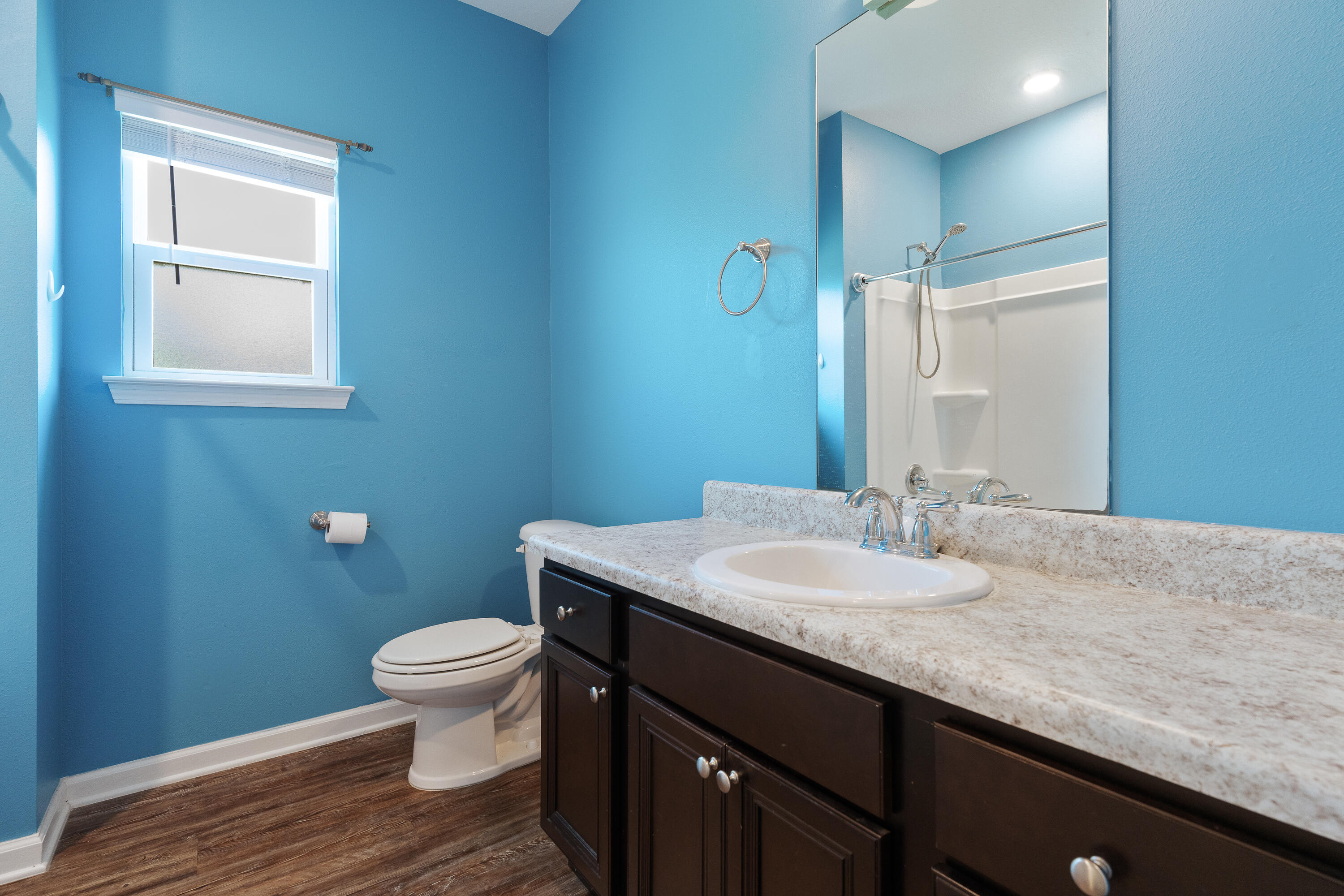 303 Merlin Court Crestview, FL 32539 - Photo 38 of 54 a bathroom with a granite countertop toilet a sink and a mirror