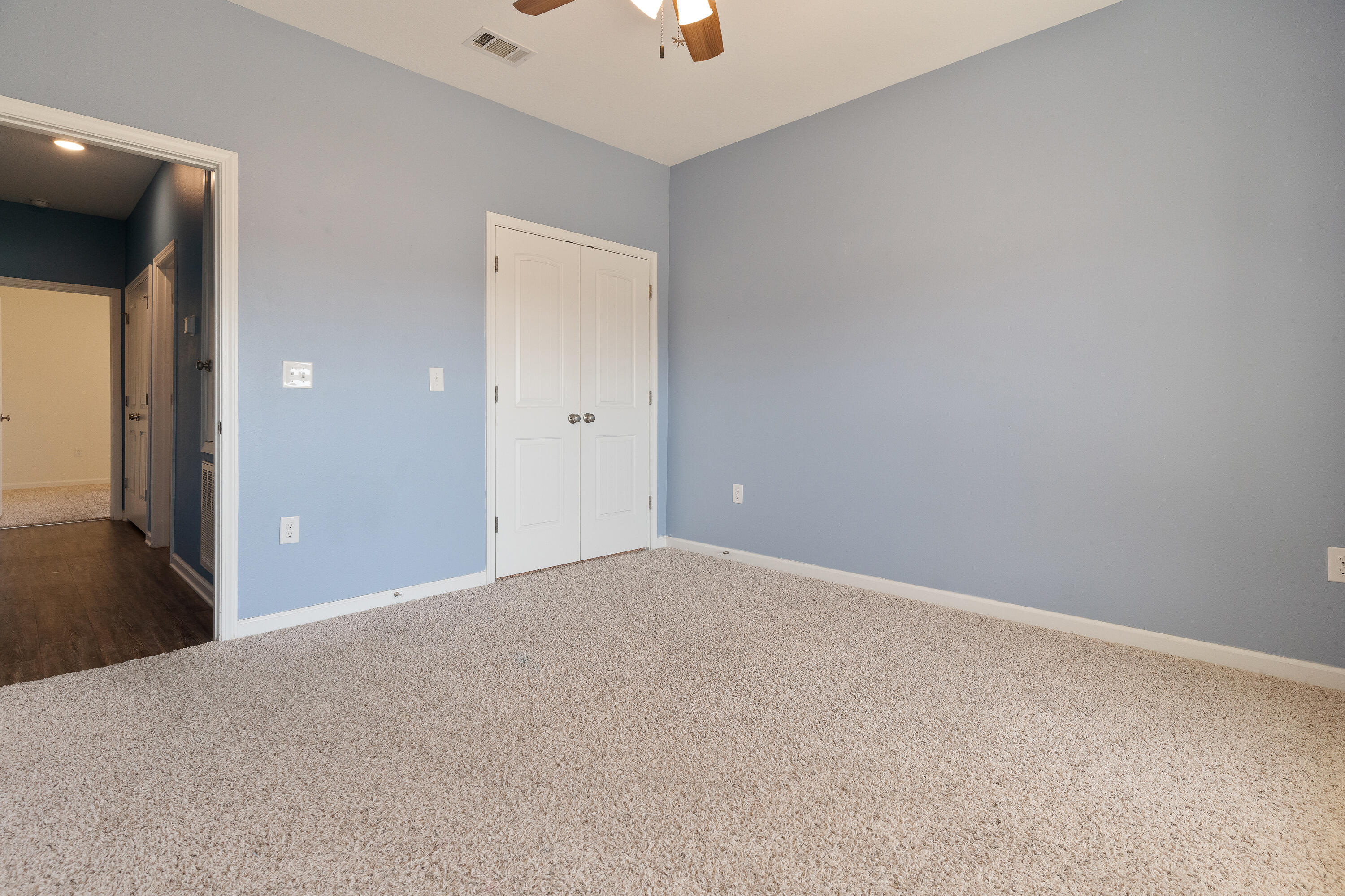 303 Merlin Court Crestview, FL 32539 - Photo 40 of 54 a view of an empty room and a ceiling fan