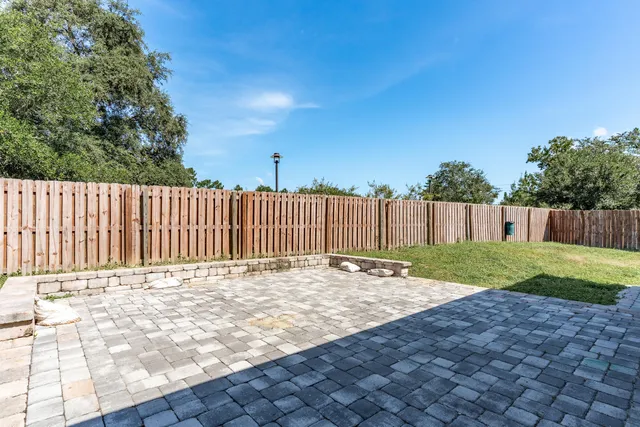 a view of a backyard with sitting area
