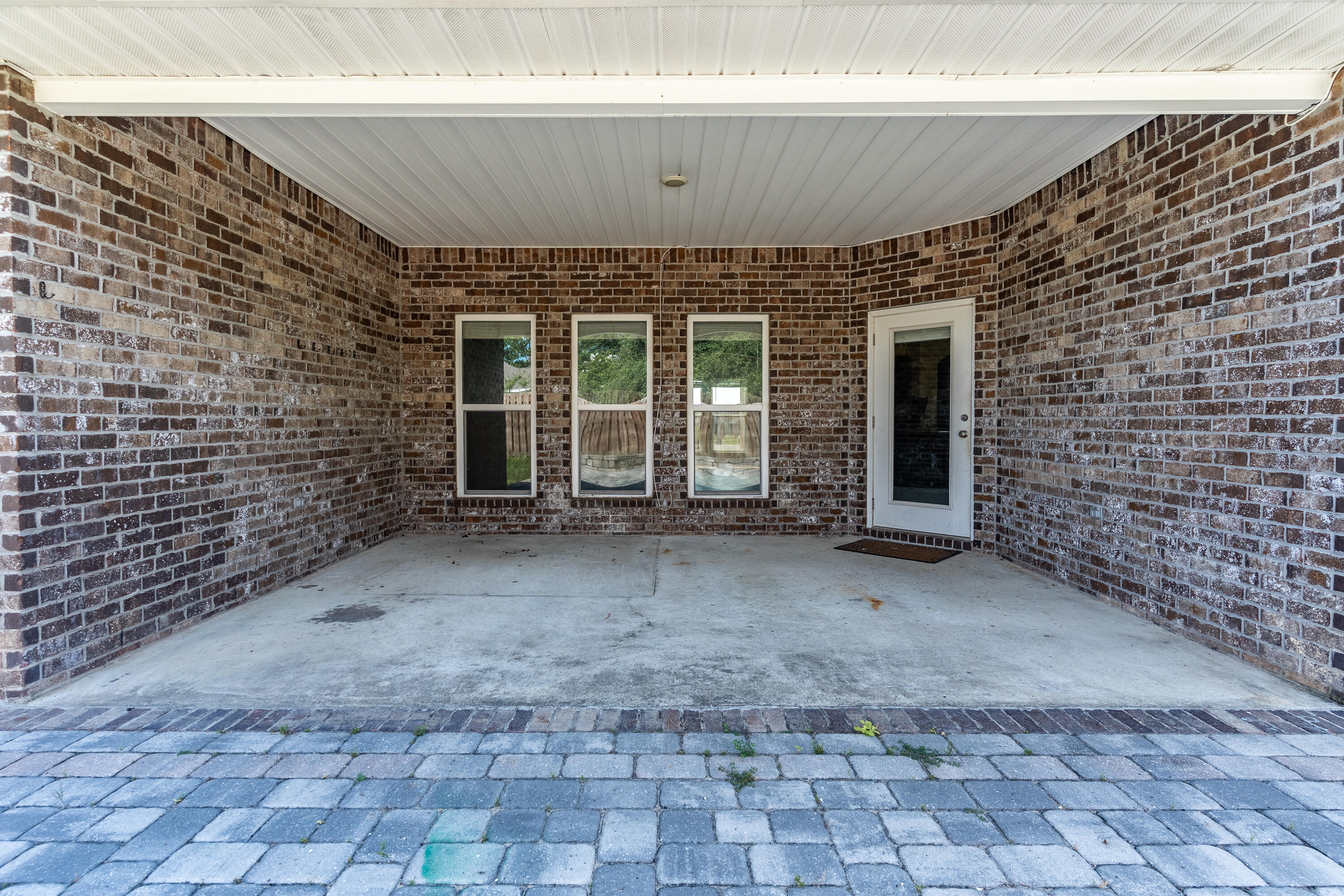 303 Merlin Court Crestview, FL 32539 - Photo 47 of 54 a view of a brick house with an empty space