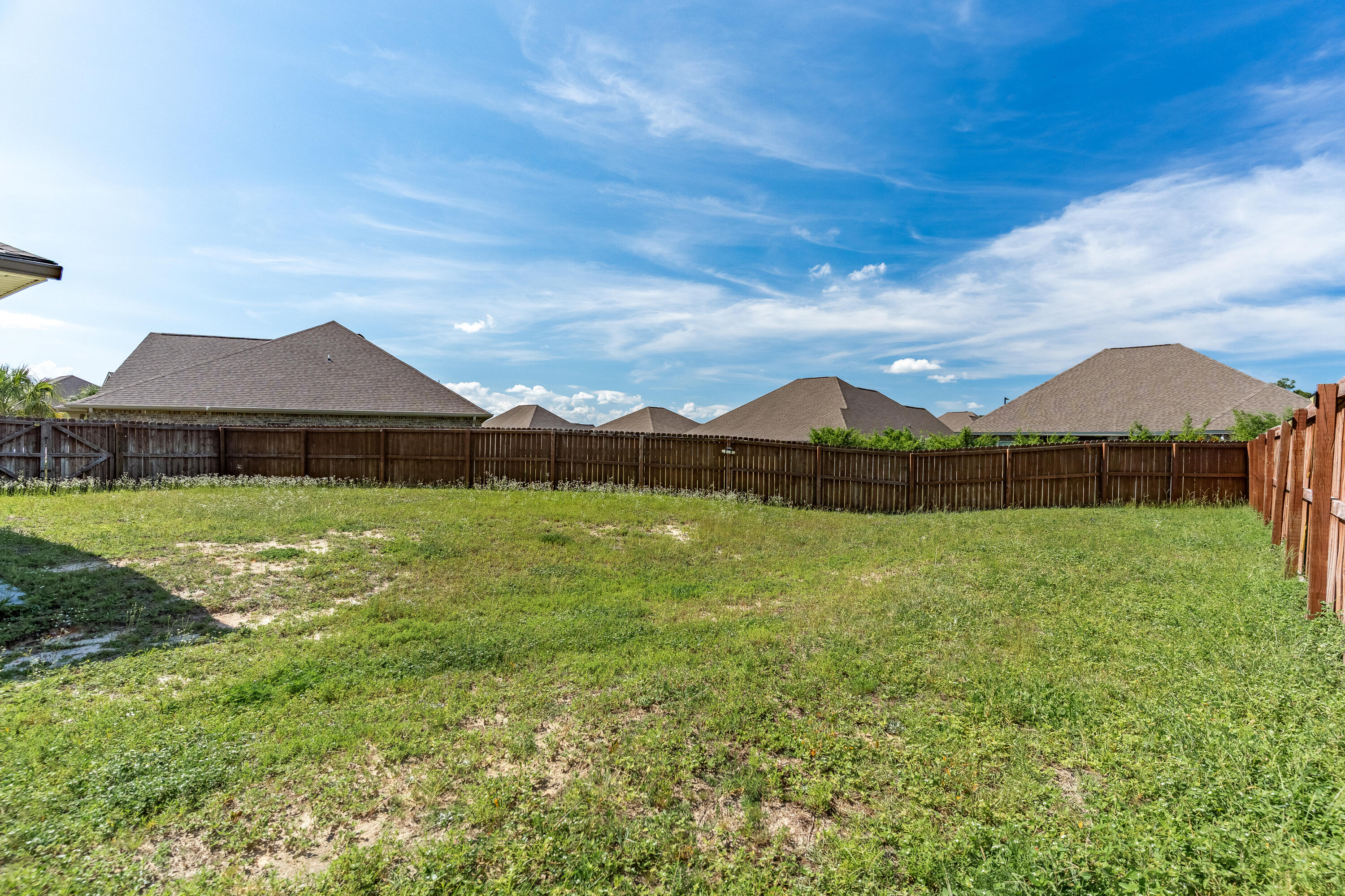 303 Merlin Court Crestview, FL 32539 - Photo 51 of 54 a front view of house with yard and mountain view in back