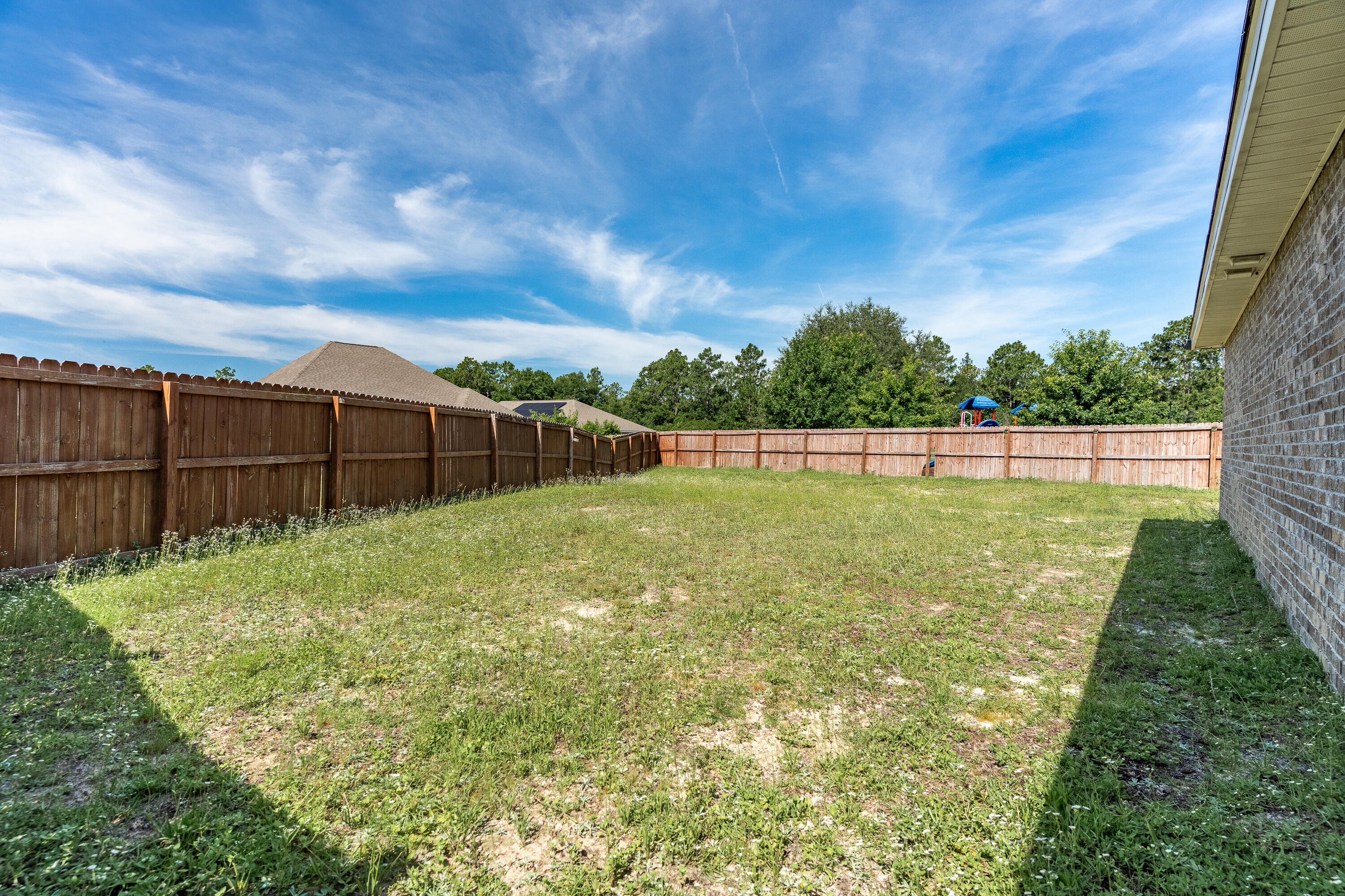 303 Merlin Court Crestview, FL 32539 - Photo 54 of 54 a view of a garden with a outdoor space