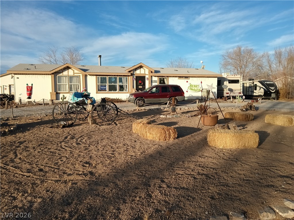 1200 Casey Road Pahrump, NV 89048 - Photo 1 of 1 A manufactured home with decorative exterior accents, perfect for tranquil desert living.